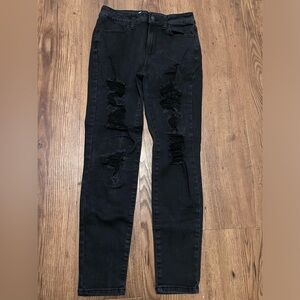 Size 5 ripped black jeans. Distressed. Stretchy material. Excellent condition.
